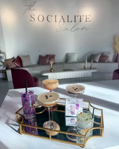 Elegant candle arrangements creating warm ambiance throughout the salon