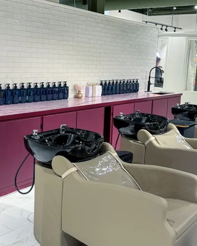 Luxury shampoo bowl stations at The Socialite Salon for relaxing hair treatments