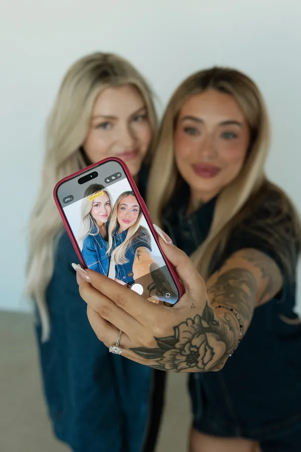 Two stylists taking a selfie together