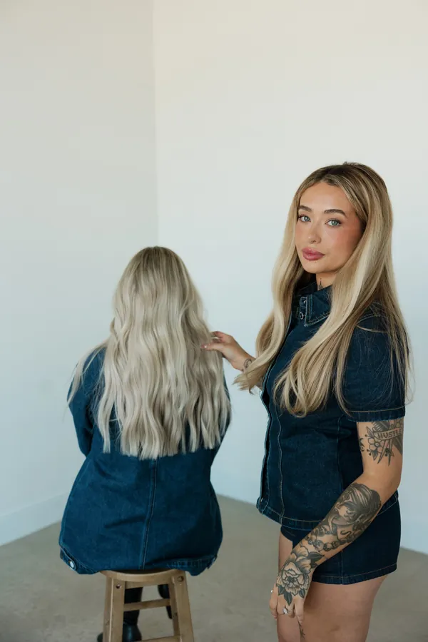 Stylists working on long blonde hair